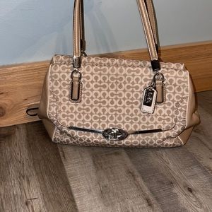 Coach tan and white handbag. Sizing: 12”W x 8”H x 5.5” D.